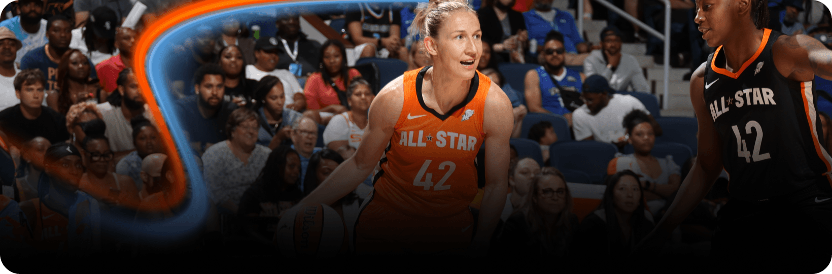 WNBA All-Star player in an orange uniform dribbles the ball with packed crowd in the background